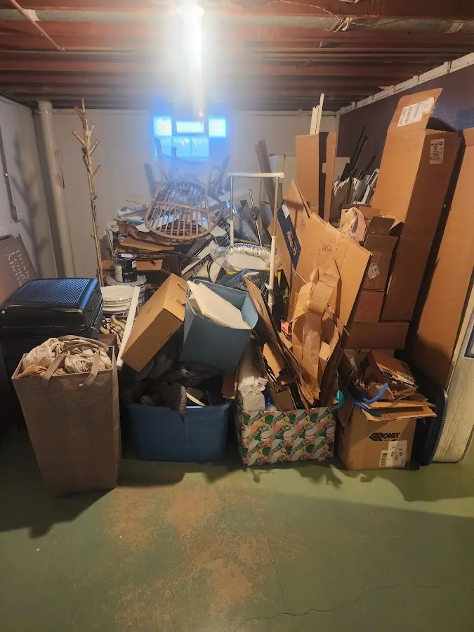 Roll-off dumpster container at job site for 15 Yard Dumpster Rental in Bedford